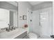 Clean bathroom with white tile shower and gray vanity at 1646 Red Tide Rd, Mount Pleasant, SC 29466