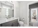 Modern bathroom with gray vanity, white countertop, and a view of a bedroom at 1646 Red Tide Rd, Mount Pleasant, SC 29466