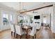 Bright dining room with hardwood floors and elegant chandelier at 1646 Red Tide Rd, Mount Pleasant, SC 29466