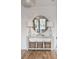 Elegant entryway with a console table, lamps, and woven baskets at 1646 Red Tide Rd, Mount Pleasant, SC 29466