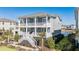 Two-story home with gray siding, white trim, and a wraparound porch at 1646 Red Tide Rd, Mount Pleasant, SC 29466