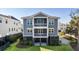 Two-story home with gray siding, balconies, and a screened porch at 1646 Red Tide Rd, Mount Pleasant, SC 29466