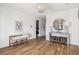 Bright foyer with hardwood floors, a bench, and a large mirror at 1646 Red Tide Rd, Mount Pleasant, SC 29466
