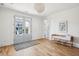 Light-filled foyer with hardwood floors and French doors leading to the outside at 1646 Red Tide Rd, Mount Pleasant, SC 29466