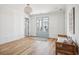 Spacious foyer with hardwood floors, light walls and French doors at 1646 Red Tide Rd, Mount Pleasant, SC 29466
