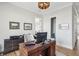 Bright home office with wood desk and access to another room at 1646 Red Tide Rd, Mount Pleasant, SC 29466