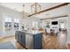 Open concept kitchen with a large island, hardwood floors, and living room views at 1646 Red Tide Rd, Mount Pleasant, SC 29466