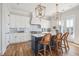 Stylish kitchen boasting white cabinets, a blue island, and light gray backsplash at 1646 Red Tide Rd, Mount Pleasant, SC 29466