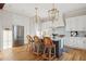 Modern kitchen with white cabinets, blue island, and hardwood floors at 1646 Red Tide Rd, Mount Pleasant, SC 29466