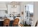 Kitchen with island seating, French doors opening to a balcony, and water views at 1646 Red Tide Rd, Mount Pleasant, SC 29466
