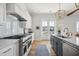 Bright kitchen, stainless steel appliances, white cabinets, and an island at 1646 Red Tide Rd, Mount Pleasant, SC 29466