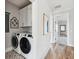 Convenient laundry room with washer, dryer, and extra storage at 1646 Red Tide Rd, Mount Pleasant, SC 29466