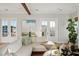 Living room with sectional sofa and access to private balcony at 1646 Red Tide Rd, Mount Pleasant, SC 29466