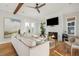 Bright living room with sectional sofa, fireplace, and hardwood floors at 1646 Red Tide Rd, Mount Pleasant, SC 29466