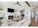 Open living room with hardwood floors, fireplace, and piano at 1646 Red Tide Rd, Mount Pleasant, SC 29466