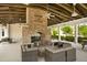 Cozy outdoor fireplace with seating area, perfect for relaxing evenings at 1646 Red Tide Rd, Mount Pleasant, SC 29466