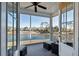 Relaxing screened porch overlooking a pond, complete with seating at 1646 Red Tide Rd, Mount Pleasant, SC 29466