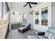 Enjoy this peaceful screened porch with comfortable seating at 1646 Red Tide Rd, Mount Pleasant, SC 29466