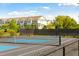 Tennis court with blue surface and surrounding fence at 1646 Red Tide Rd, Mount Pleasant, SC 29466