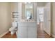 Small bathroom with white vanity, toilet, and shower at 209 Charleston Blvd, Isle of Palms, SC 29451