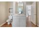Small bathroom with white vanity, toilet, and shower at 209 Charleston Blvd, Isle of Palms, SC 29451