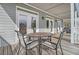 Deck with table and chairs, offering outdoor dining space at 209 Charleston Blvd, Isle of Palms, SC 29451