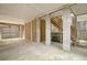 Unfinished garage with concrete floor and wooden stairs at 209 Charleston Blvd, Isle of Palms, SC 29451