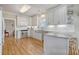 Bright kitchen with granite countertops, stainless steel appliances, and white cabinets at 209 Charleston Blvd, Isle of Palms, SC 29451
