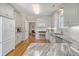 Bright kitchen with granite countertops, stainless steel appliances, and white cabinets at 209 Charleston Blvd, Isle of Palms, SC 29451