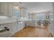 Kitchen with granite countertops, stainless steel appliances, and hardwood floors at 209 Charleston Blvd, Isle of Palms, SC 29451