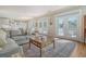 Living area with access to deck and adjacent to kitchen at 209 Charleston Blvd, Isle of Palms, SC 29451