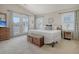 Spacious main bedroom with king-size bed and access to a private balcony at 209 Charleston Blvd, Isle of Palms, SC 29451