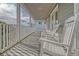 Relaxing porch with rocking chairs and white railing at 209 Charleston Blvd, Isle of Palms, SC 29451