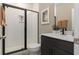 Modern bathroom with a shower and dark vanity at 212 Yorkshire Dr # 5, Moncks Corner, SC 29461