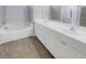 Bathroom boasts double sinks, a soaking tub, and tile flooring at 217 Forsythia Ave, Summerville, SC 29483