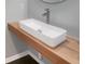 Modern bathroom with floating wood vanity and rectangular sink at 217 Forsythia Ave, Summerville, SC 29483