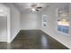 Bright dining room features hardwood floors and large windows at 217 Forsythia Ave, Summerville, SC 29483