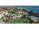 Aerial view of community pool, tennis courts, and waterfront at 25 Mariners Cay Dr, Folly Beach, SC 29439