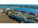 Aerial view of waterfront community with pool, tennis courts, and boat slips at 25 Mariners Cay Dr, Folly Beach, SC 29439