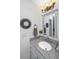 Clean bathroom with granite vanity, single sink and mirror at 25 Mariners Cay Dr, Folly Beach, SC 29439