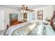 Bedroom with a large wooden bed, decorative pillows, and ceiling fan at 25 Mariners Cay Dr, Folly Beach, SC 29439
