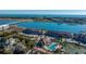 Aerial view of community, pool, tennis courts, and waterway at 25 Mariners Cay Dr, Folly Beach, SC 29439