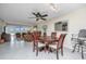 Wood dining table with four chairs, overlooking living room at 25 Mariners Cay Dr, Folly Beach, SC 29439