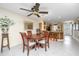 Bright dining room with a wood table and chairs, and access to the kitchen at 25 Mariners Cay Dr, Folly Beach, SC 29439
