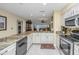 Open concept kitchen with granite and stainless steel appliances at 25 Mariners Cay Dr, Folly Beach, SC 29439