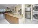 Granite countertops, stainless steel appliances, and breakfast bar at 25 Mariners Cay Dr, Folly Beach, SC 29439