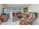 Comfortable living room with a sectional sofa, armchairs, and water views at 25 Mariners Cay Dr, Folly Beach, SC 29439