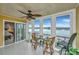 Sunroom with water views and a small table and chairs at 25 Mariners Cay Dr, Folly Beach, SC 29439