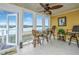 Bright sunroom with water views and comfortable seating at 25 Mariners Cay Dr, Folly Beach, SC 29439