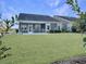 Large backyard with screened porch and green lawn at 3002 Cross Vine Ln, Summerville, SC 29483